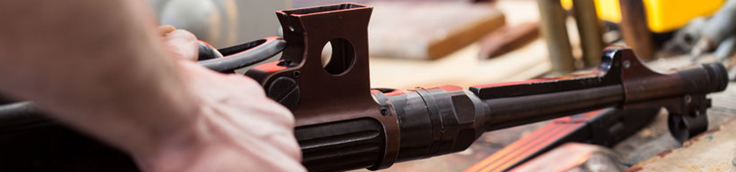 Photo of Person Working on a Rifle