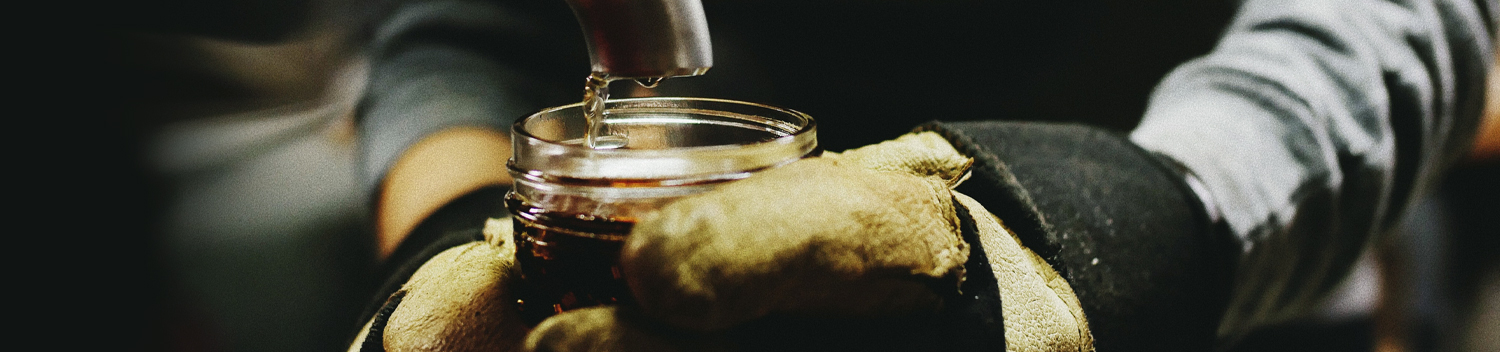 Photo of Maple Syrup Pouring from a Tap